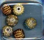 Glasperlen mit Rocailles bestickt gelb-gold